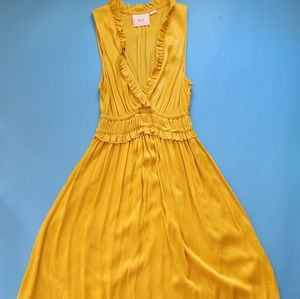Yellow sleeveless Maeve Anthropologie dress.